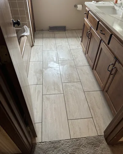Large-format tile floor in a bathroom